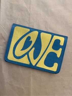 Shiraleah Teal and Yellow 'LOVE' Graphic Fold-Over Clutch